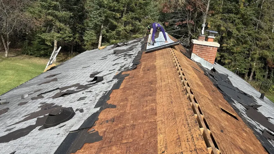 Before: tear-off in progress on an old roof