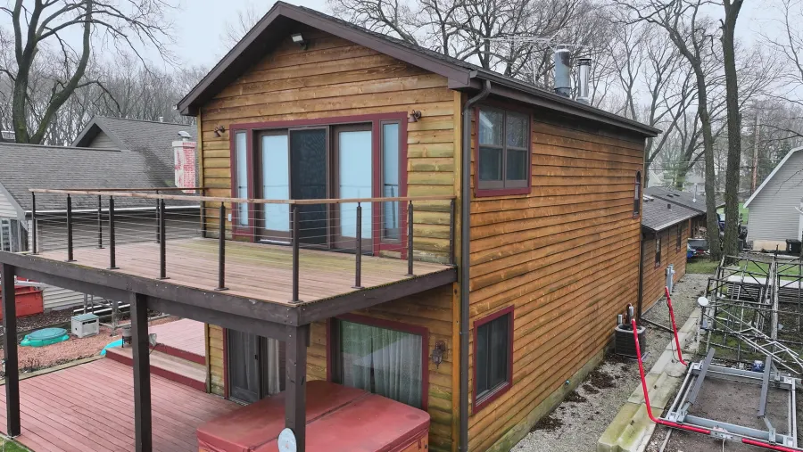 Before: worn wood siding