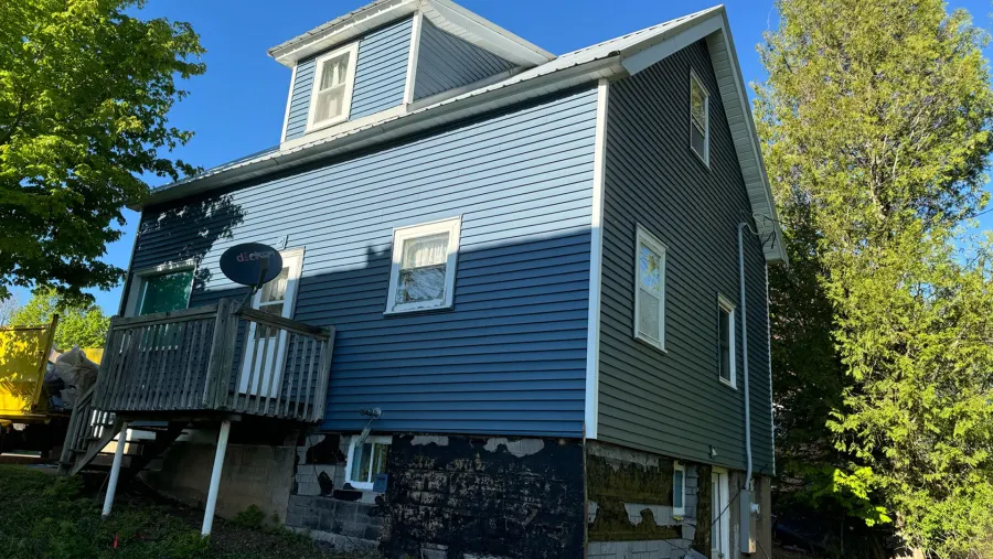 After: new siding installed by 3 Brothers Construction