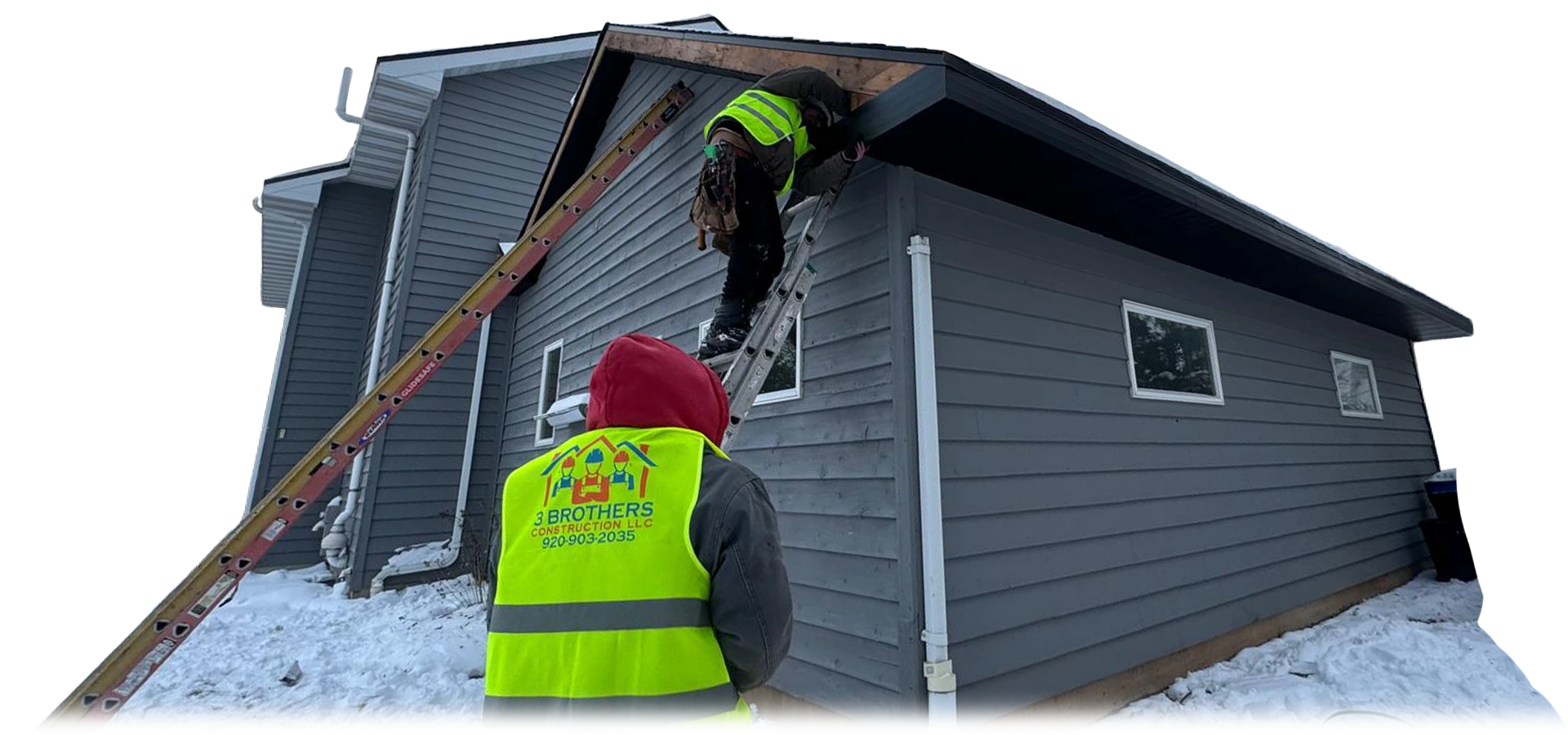 3 Brothers Construction crew in branded high-vis vests working a roofline in the snow, Wisconsin