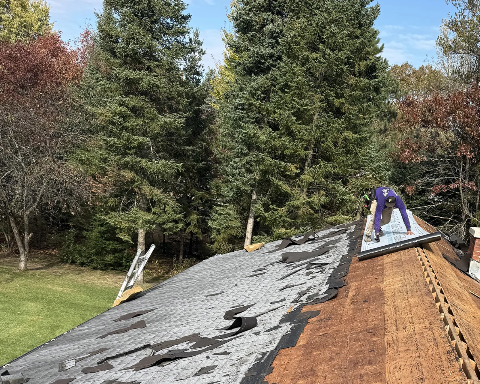 Before: worn shingle roof before replacement