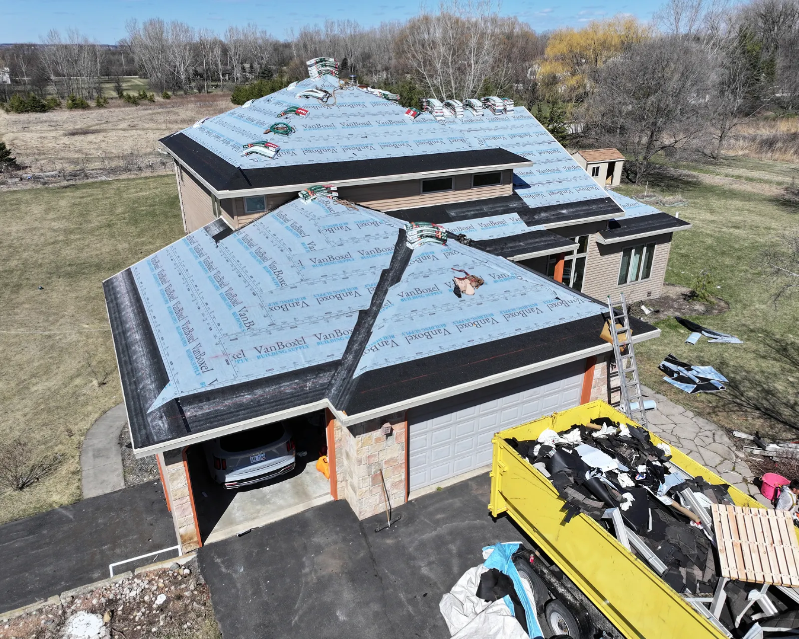 Before: worn shingle roof before replacement