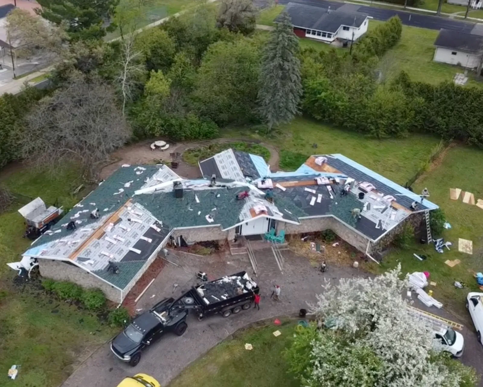 Before: worn shingle roof before replacement