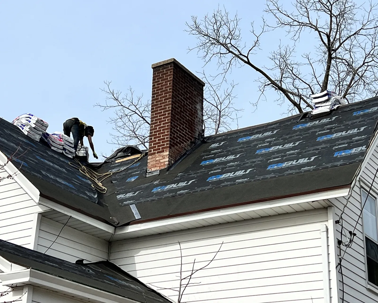 Before: worn shingle roof before replacement
