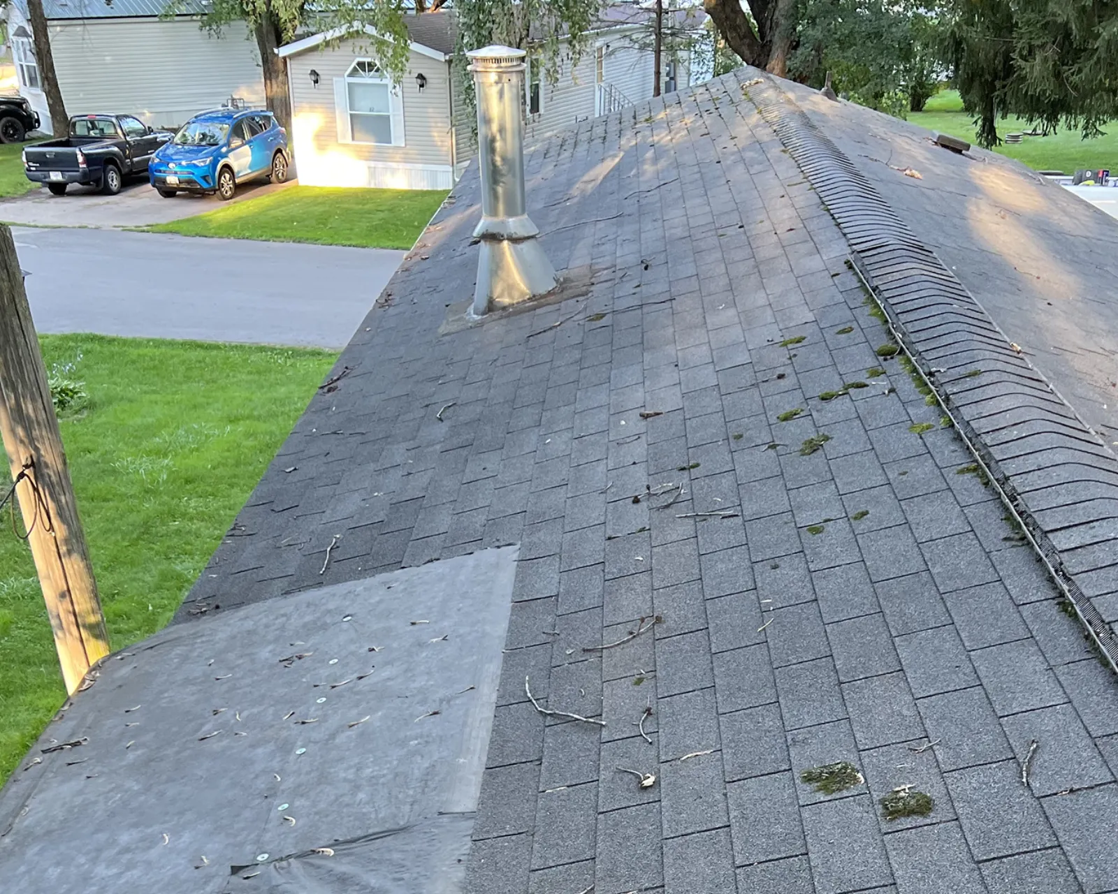 Before: worn shingle roof before replacement