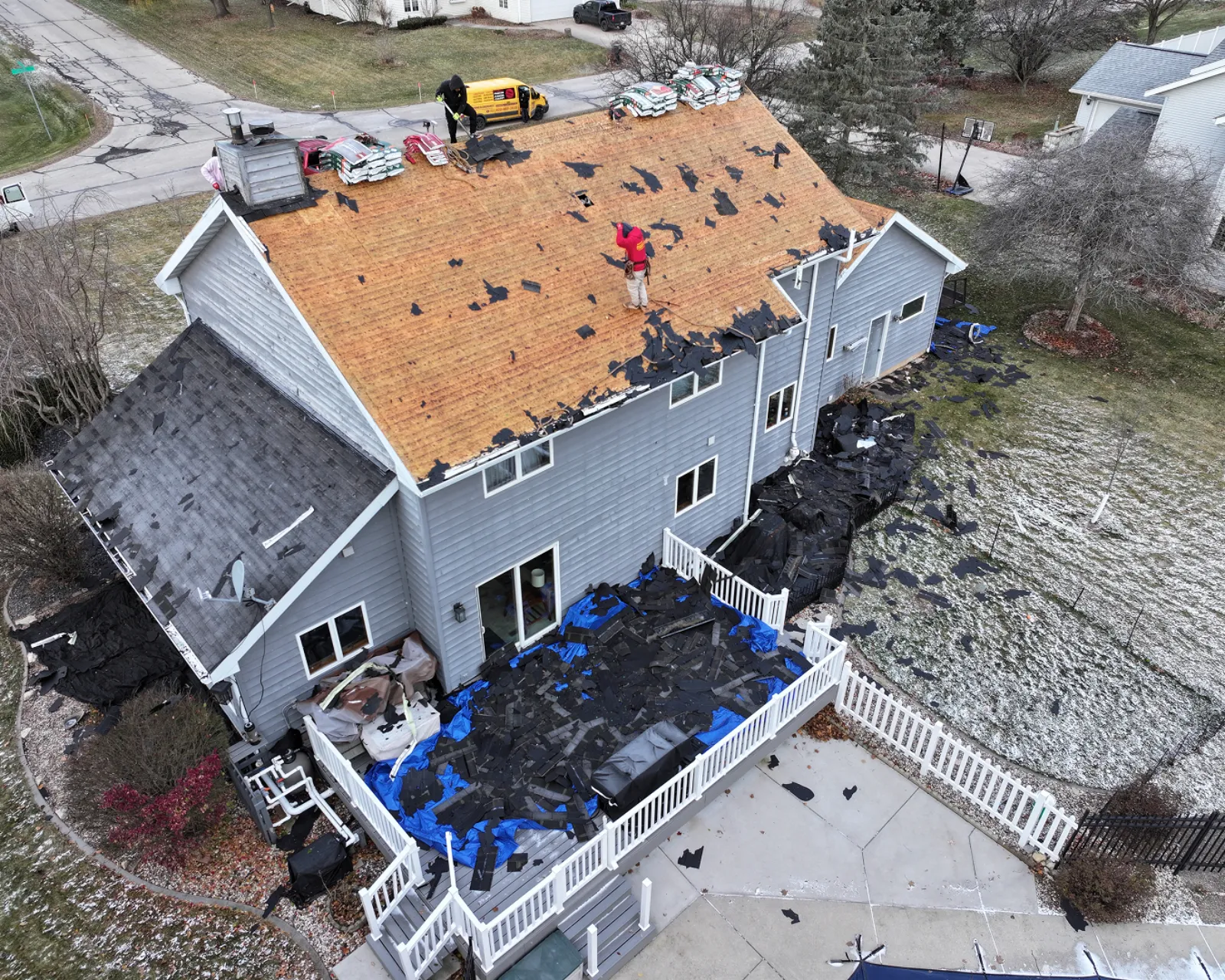 Worn shingle roof being torn off by 3 Brothers Construction