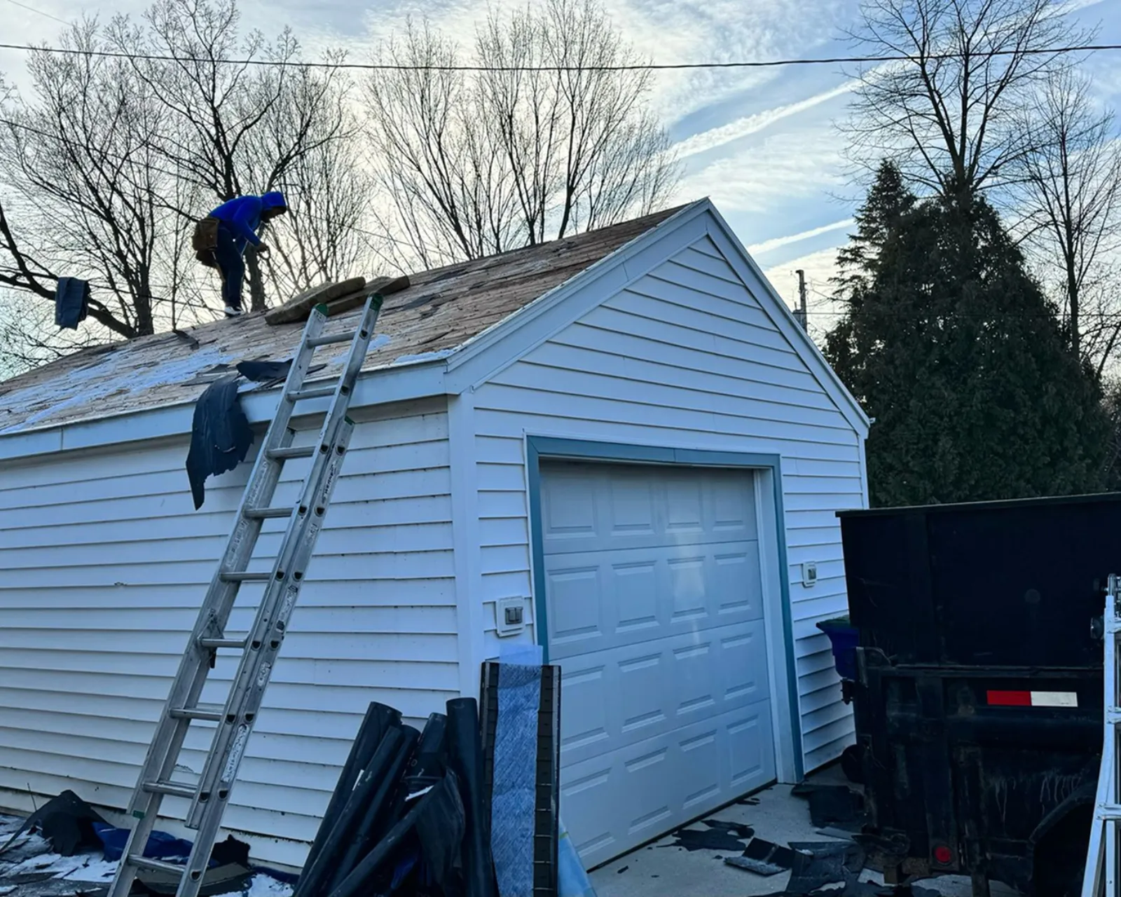 Before: worn shingle roof before replacement
