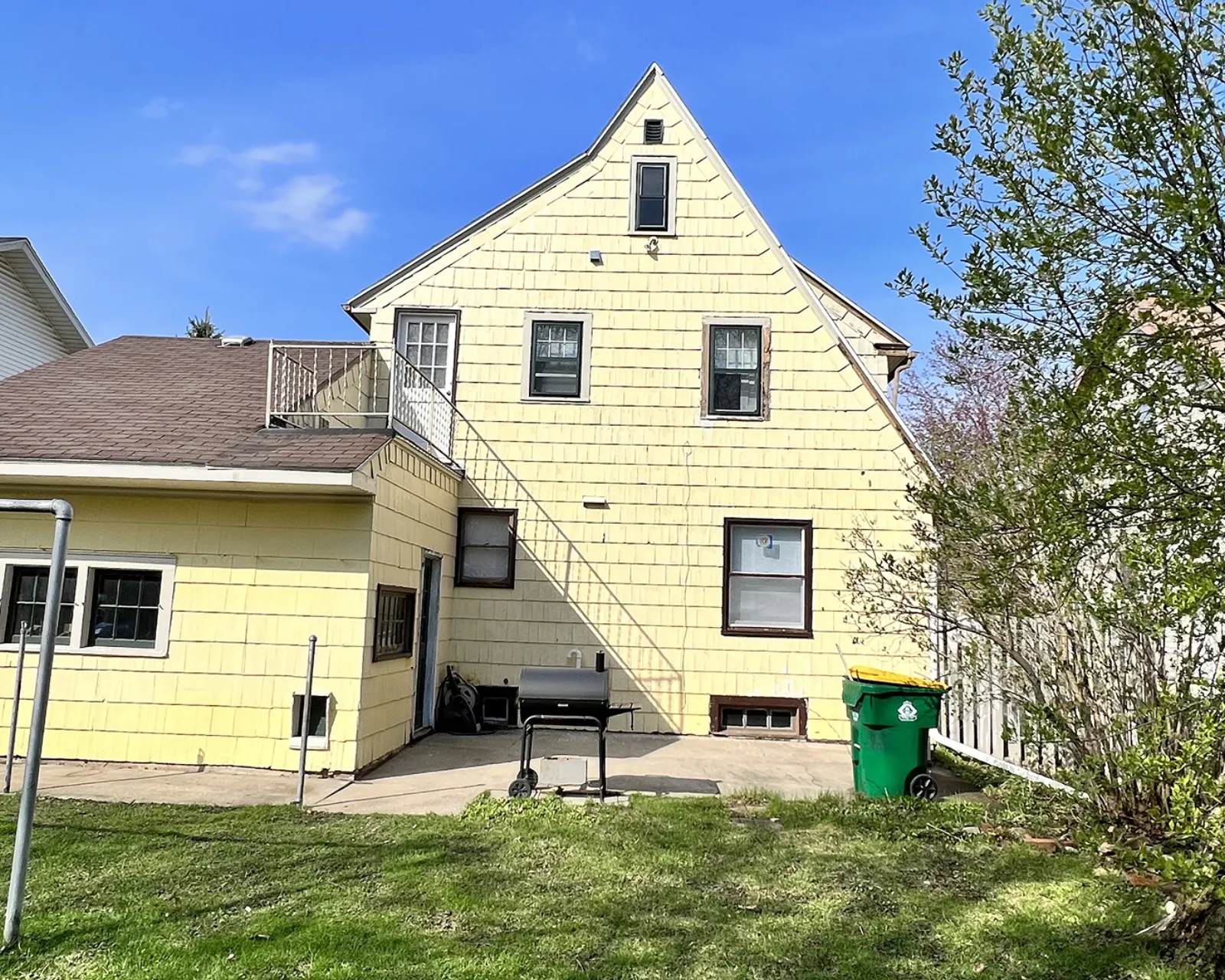 Before: worn or damaged siding before replacement