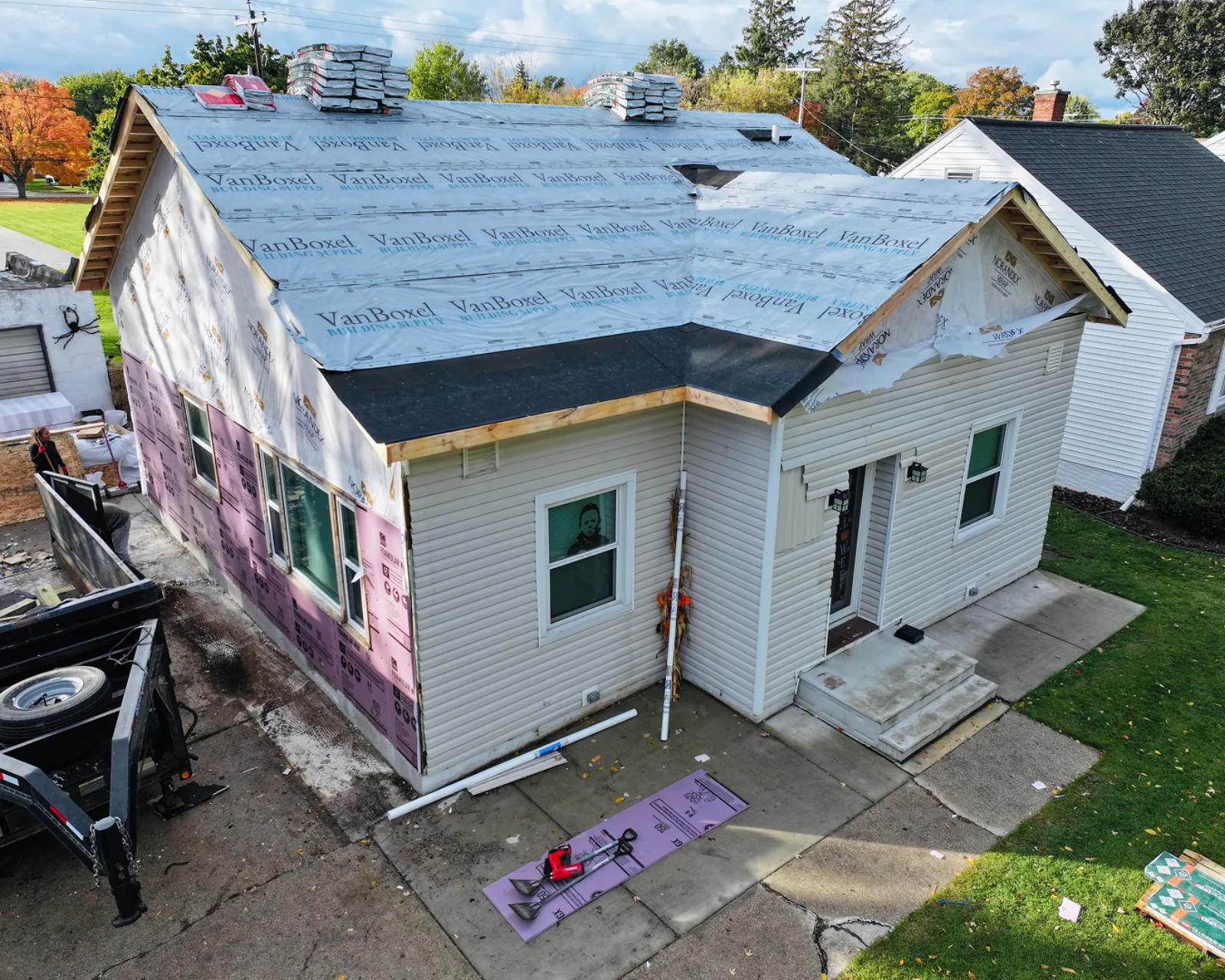 Before: worn or damaged siding before replacement
