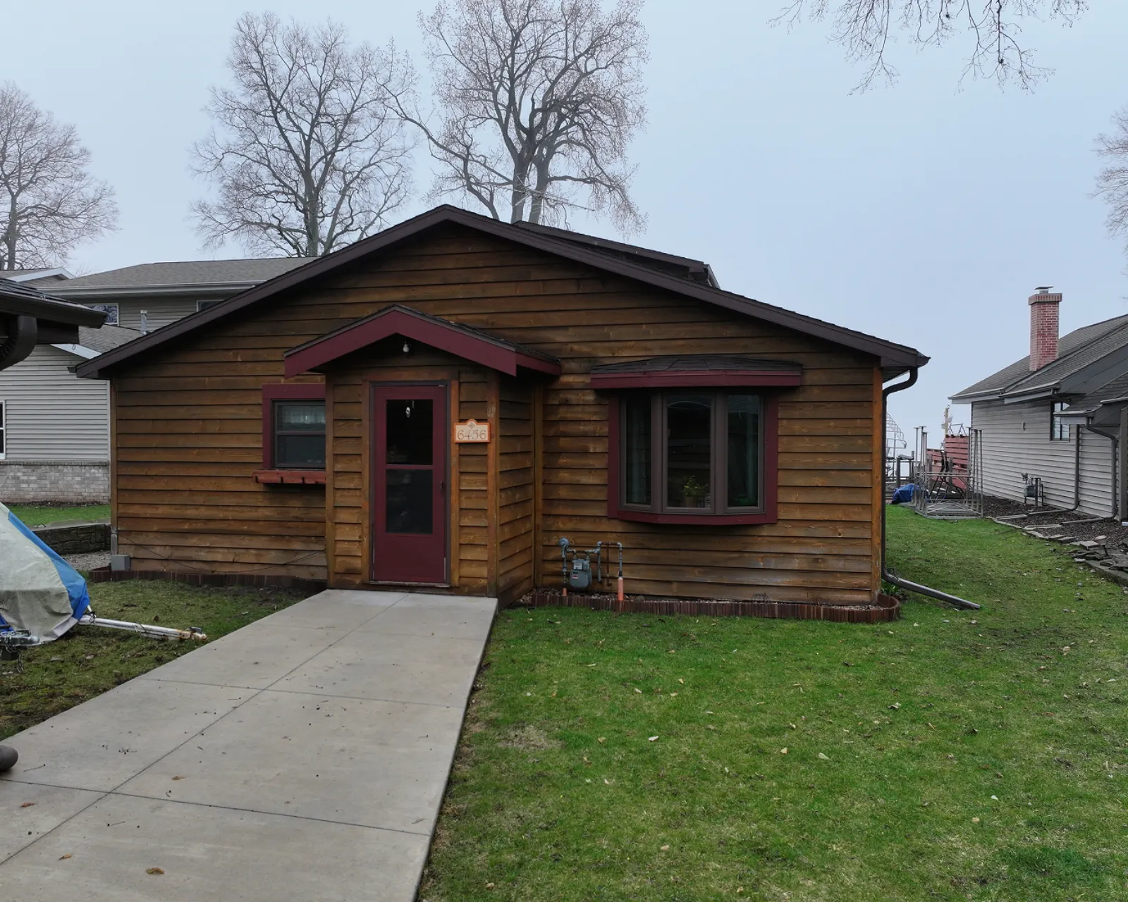 Before: worn or damaged siding before replacement